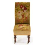 A Victorian walnut nursing chair, in contemporary floral Berlin woolwork Dusty and with small