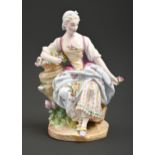 A German porcelain figure of a flower gatherer, late 19th c, 21cm h Good condition but for typical