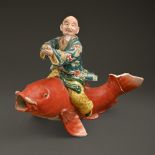 A Chinese porcelain figure of Qin Gao riding a carp, Qing dynasty, 19th c, 20cm h Damaged with