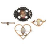 An opal brooch, in gold, 35mm, marked 585, another, a gold safety pin with split pearl initial E and