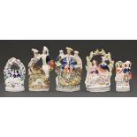 Five Staffordshire flatback figures and groups, mid 19th c, 20cm h and smaller Arbor group broken