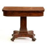 A William IV rosewood card table, on panelled pillar, platform and volute feet, with castors, 75cm