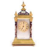 A French brass and champleve enamel carriage clock, early 20th c, with pillars, finials and ogee