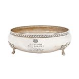 An Elizabeth II silver fruit bowl, with gadrooned rim, on three cast scroll feet, 21cm diam, by A