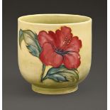 A Moorcroft Hibiscus cache pot, c.1975-85, with yellow ground, 13cm h, impressed marks, painted