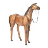 A Victorian leather clad model of a horse, 95cm h Ears scuffed to edges, otherwise overall good