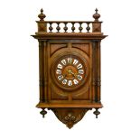 A German walnut wall clock, the dial with enamelled chapters, 60 x 41cm, key and pendulum