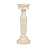 A carved and turned marble torchere, early 20th c, on reeded pillar and octagonal base, 70cm h Minor