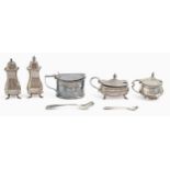 A George V three-piece silver condiment set and two mustard pots, blue glass liners, pepperette 95mm