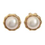 A pair of baroque pearl ear clips, in gold, 16mm diam, marked 18k 750, 7.6g Good condition