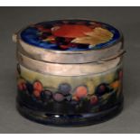 A Moorcroft Pomegranate lidded box, c1930, with silver plated mount, 90mm diam, impressed marks Good