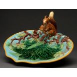 A George Jones majolica nut dish, moulded with hazelnuts and applied with squirrel handle, the