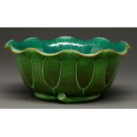 A Chinese lotus shaped bow, 20th c,  in mottled green and teal glazes, the curing stalk forming