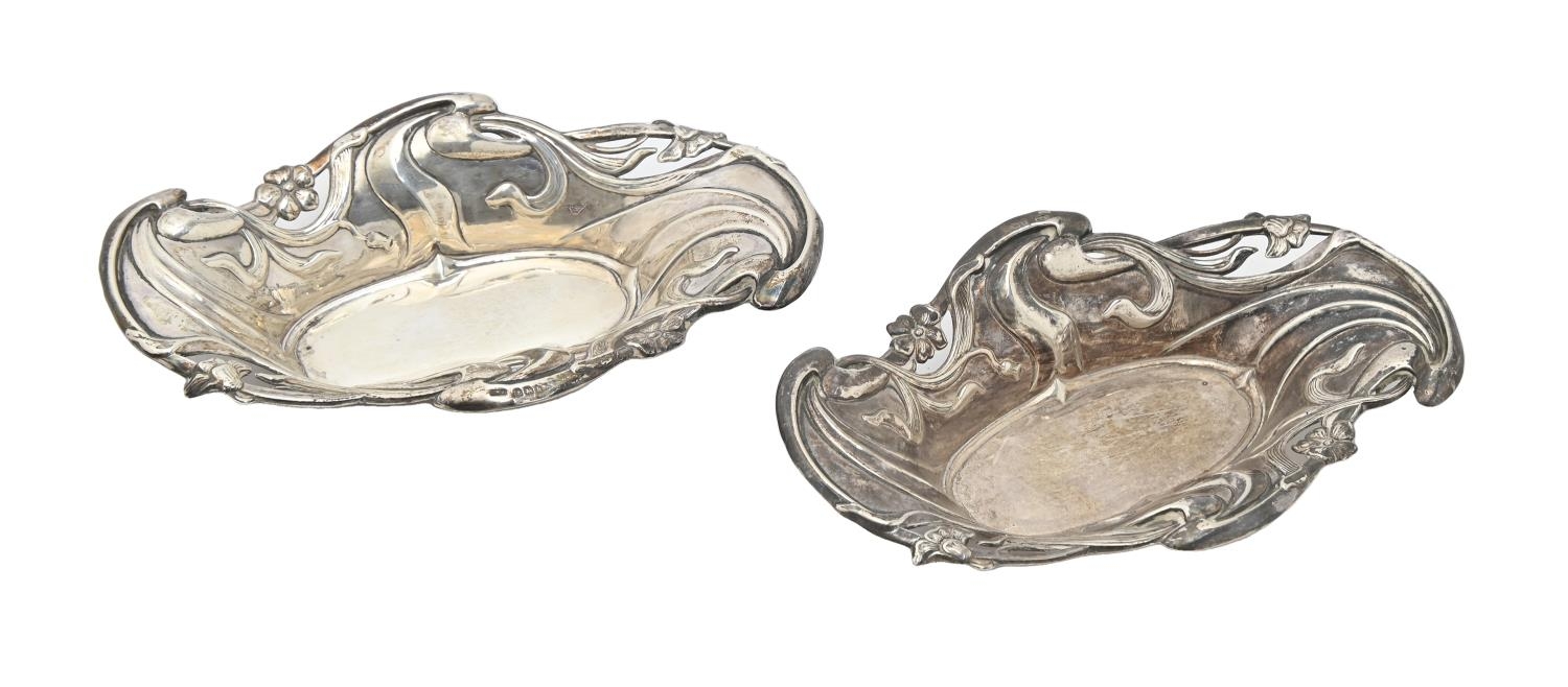 A pair of Edwardian Art Nouveau die stamped silver bonbon dishes, 15cm l, by C T Burrows & Sons,