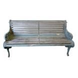 A Victorian cast iron garden bench,  the ends decorated with naturalistic flowers and strapwork,