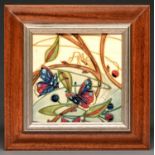A Moorcroft plaque, 2002, of butterflies, 19.5 x 19.5cm, impressed and painted marks, framed Good