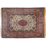 An antique Isfahan carpet, 257 x 367cm Localised staining and wear