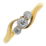 A three stone diamond ring, collet set, in gold marked 18ct, 2.7g, size N Wear to settings