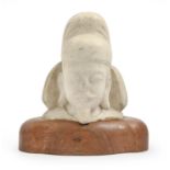 A South East Asian marble sculpture of the head, of an immortal,  29cm h, on wood stand No