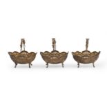 A set of three Edward VII die stamped silver bonbon baskets, with swing handle, 10.5cm h, by Henry