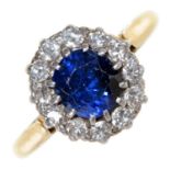 A sapphire and diamond cluster ring, gold hoop, 4.7g, size P Slight wear scratches on facets of