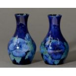A pair of Moorcroft Blue Poppy vases, c1920, 13.5cm h, impressed marks, painted initials
