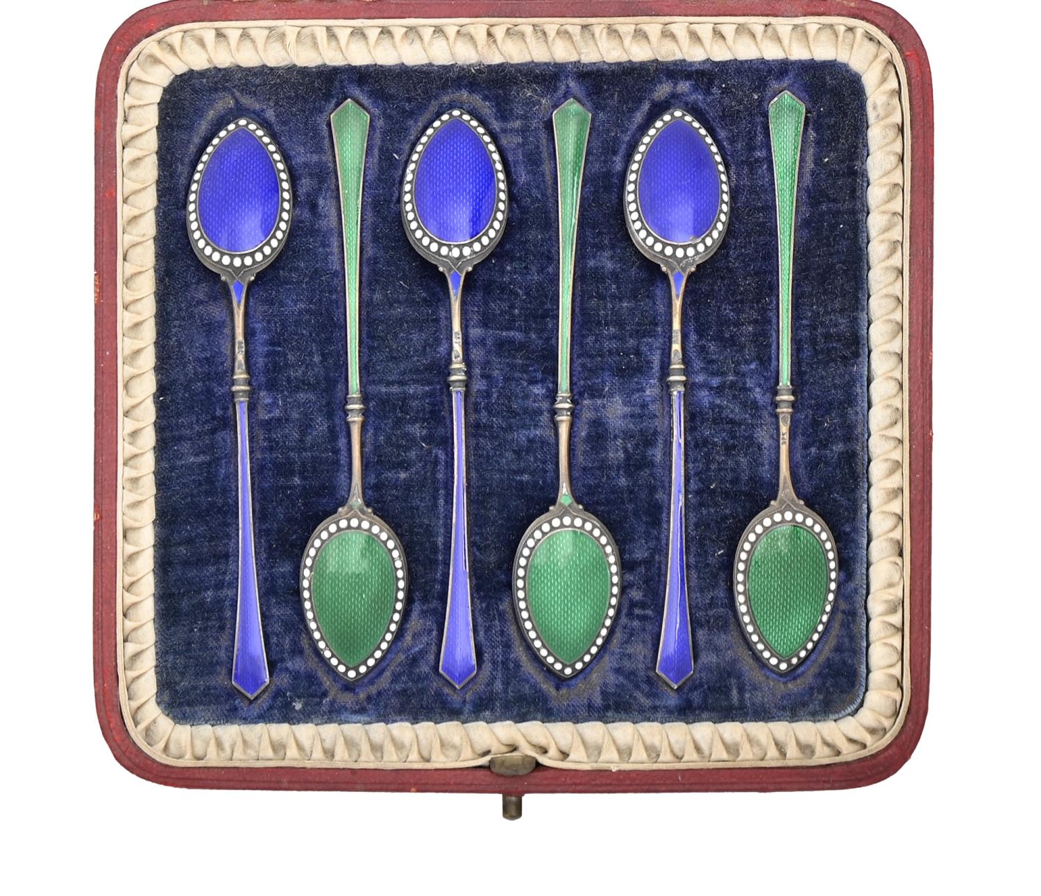 A set of six silver gilt and enamel coffee spoons, import marked, W F Bateman, London 1898, cased,