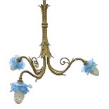 A giltmetal three branch chandelier, early 20th c, with moulded blue glass shades One shade badly