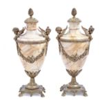 A pair of French marble urns, late 19th / early 20th c, in Louis XVI style and of shield shape