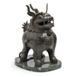 A Chinese bronze dog of Fo incense burner, 19th/20th c, the head forming the lid, 30cm h and a