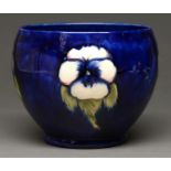 A Moorcroft Pansy jardiniere, c1930-1936, painted signature Glaze with localised kiln sand adhered