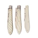 Three Victorian silver fruit knives, with wrythen fluted mother of pearl scales, various lengths,