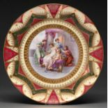 A Continental porcelain dish, early 20th c, in Vienna style, printed and painted with The Toilet