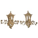 A pair of gilt japanned and lacquered wood and metal chinoiserie wall lights, 20th c, in 18th c