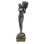 A life size black resin garden statue of a naked woman,  holding a waterlily, 160cm h excluding