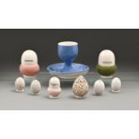 Eight James Macintyre & Co acorn and bird's egg shaped luncheon and other salt and pepper pots,