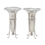 A pair of Edwardian pierced silver vases and wirework stands, 14cm h, by The Goldsmiths &