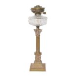 A brass Corinthian column oil lamp, c1900, with moulded glass fount and brass Hinks No 1 lever