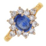 A sapphire and diamond cluster ring,  in gold, marked 750, 4.6g, size Q Good condition