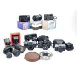 Three Pentacon and other 35mm single lens reflex cameras, several lenses and accessories Condition