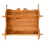 A set of three pegged and boarded waxed pine hanging shelves, 69cm h, 70cm l Stained and scratched