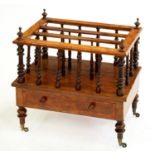 A Victorian walnut canterbury, with turned spindles and legs, brass castors, 56cm h; 38 x 54cm Minor
