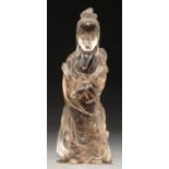 A Chinese rock crystal figure of Guanyin, 20th c, 26cm Left foot chipped, other smaller chips and