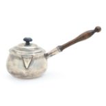 A George III Irish silver saucepan, the ogee domed cover with hinged lip-cover, baluster pearwood