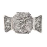 A Burmese silver repousse waist belt clasp, late 19th c, 15cm l, 4ozs Slightly bent and small