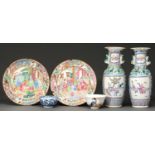 A pair of Chinese Canton famille rose vases, late 19th c, 26cm h, a pair of similar plates and two