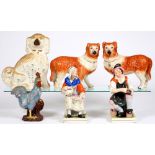 A pair of Staffordshire figures of Jobson, the cobbler, and Nell, his wife, 19th c, decorated in