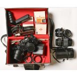A Pentax Super A camera, with 1:1.7 50mm lens, other lenses and further photographic accessories,