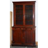 An Edwardian mahogany bookcase, the lower part with drawers with replacement bakelite handles