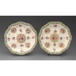 A pair of Copeland moulded dessert plates, 1902, painted with single roses, in turquoise and gilt